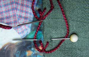 using a pin to hold threads in position