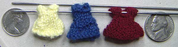 Miniature knitted dresses