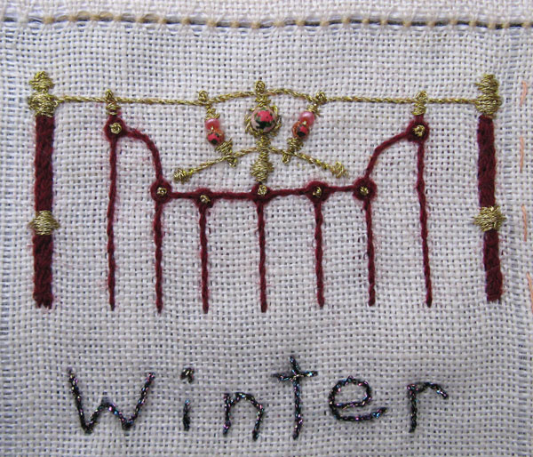 embroidered brass bedhead and winter