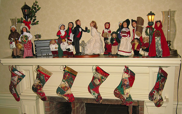 All 6 stockings hanging above the fireplace